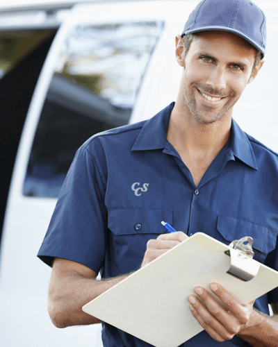 a Custom Cabling Employee holding a clipboard at a customers house after installing network cabling